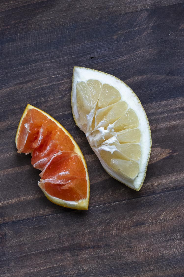 Slice of an orange and grapefruit inverted to show the pulp